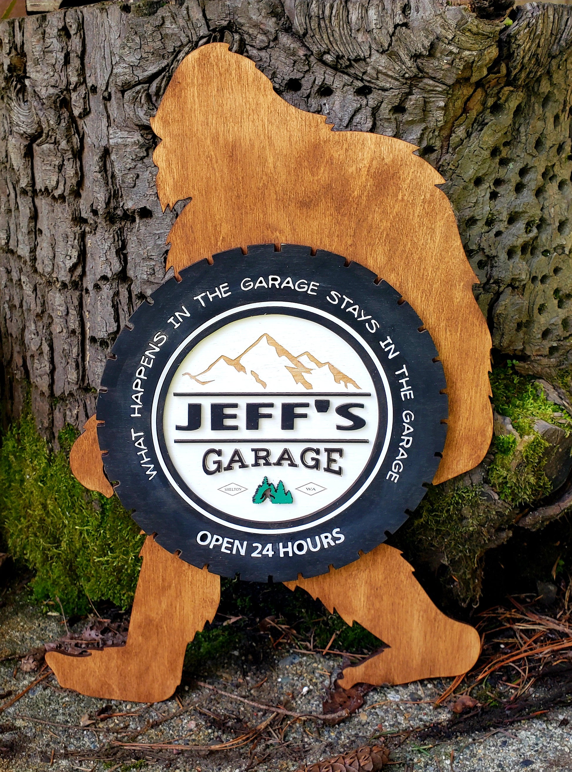 Take the road less traveled with our Bigfoot Garage Sign! Whether you're a mystery-lover or just like to keep things wild, this sign lets you personalize your garage with 24 hours of guaranteed no-questions-asked fun. Hand painted on durable birch wood, with a tire and bigfoot image, this sign will make sure you always remember - "What happens in the garage, stays in the garage!"