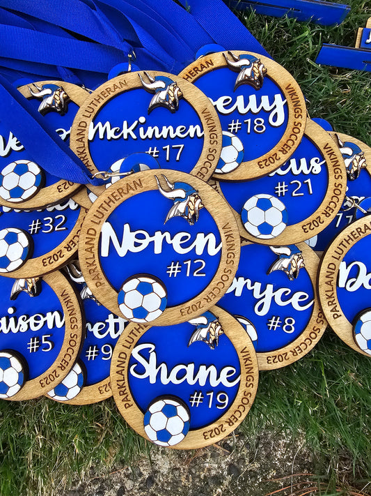 Our Award Medallion is a unique team recognition token, perfect for any special event or sports team. Laser cut for precision, it can be personalized with a team name, logo, and school colors. A timeless way to recognize individual and team achievements.&nbsp;