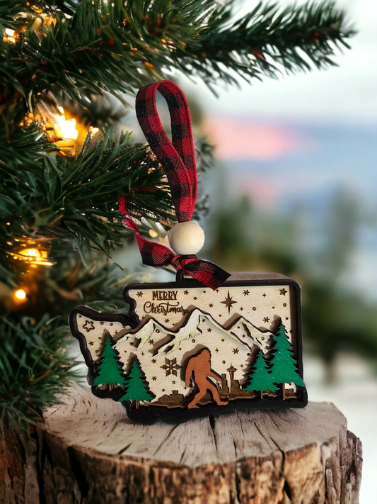 Bring the Pacific Northwest right to your tree with this one-of-a-kind Big Foot WA state Ornament! Hand-crafted from birch wood in layers, this unique ornament features classic Big Foot, WA state, and a Seattle skyline—all the things you love about the PNW!  So don't miss out on this unique item—it'll be gone faster than you can say "Sasquatch!"