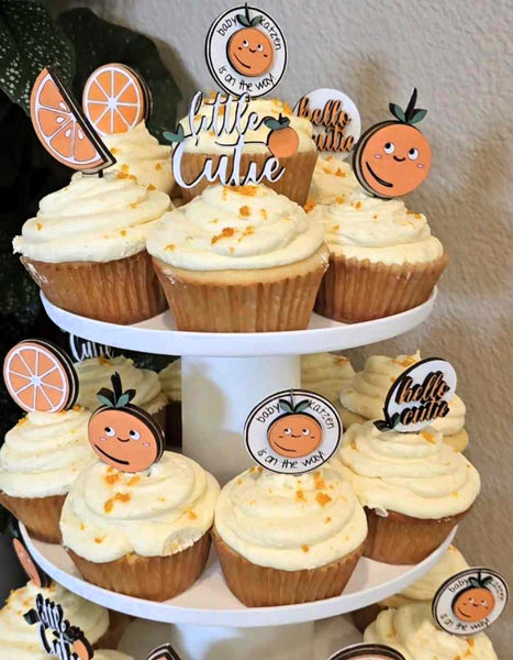 Bring your baby shower cake to life with these hand-painted and personalized Cake Toppers! Decorated with bright citrus slices, orange blossoms, and adorable cuties, these cheerful little friends will make sure your party is sweet as a slice of orange! Let the citrus vibes flow!  