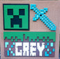 This custom design is minecraft-inspired and is the perfect wall decor for any room! This beautiful piece is crafted with birch wood and laser cut for a clean, precise finish. It is hand painted and personalized for a unique look and measuring 15x15, it is the perfect size for any space.  Ships within 5-7 business days.