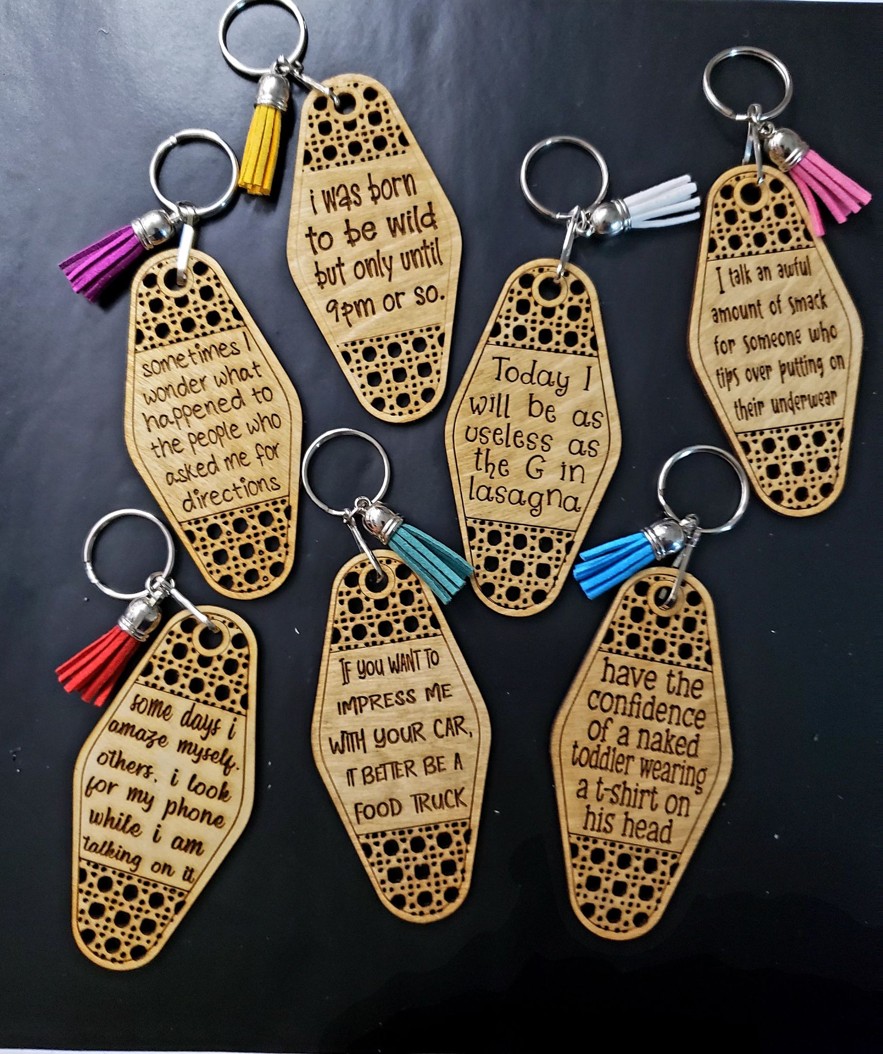 Check out these charming Retro style Hotel Keychains, featuring a rattan weave and comical sayings. With dimensions of approx. 4" x 2" (not counting the clip and ring), each Keychain comes with a complementary tassel attached. The Keychains are crafted from Baltic Birch and the varying colors of the tassels make for an interesting contrast. Ships in 5 to 7 days.