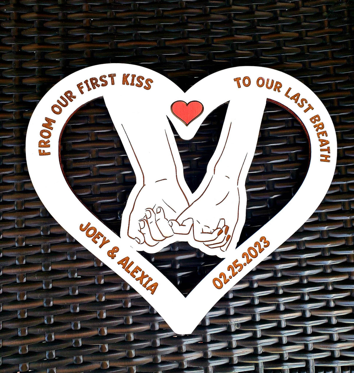  This unique gift is ideal for the newly married or engaged couple. Boasting a 12.5" x 11" size, the customized sign is cut from Birch wood and professionally hand-painted with white acrylic paint. Orders usually ship within 5-7 days of being placed and can be personalized with the couple's name and date.