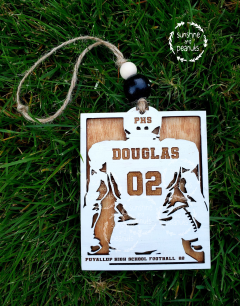 Our personalized Football Player Ornament is the perfect way to commemorate your athlete's season. Made with Birch Wood and stained with a light maple backing and white front, this 2.75" x 3.5" ornament can be personalized with the player's name, jersey number, school monogram, team name, and year. Give your football star a keepsake that will last a lifetime!