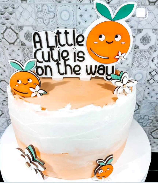 Bring your baby shower cake to life with these hand-painted Cake Toppers! Decorated with bright citrus slices, orange blossoms, and adorable cuties, these cheerful little friends will make sure your party is sweet as a slice of orange! Let the citrus vibes flow!