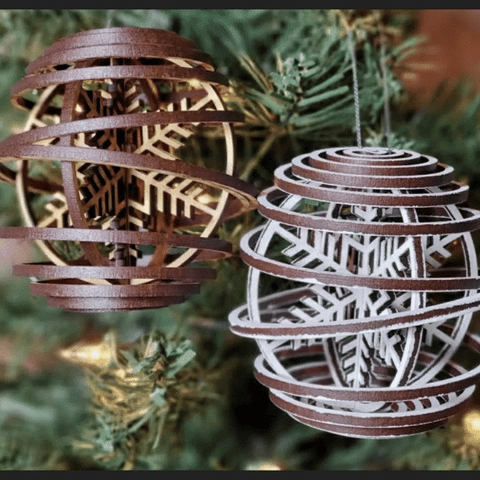 Be the envy of the winter season with this beautiful Snowflake Orb Ornament. Crafted from laser-cut birch wood, each spiral orb is adorned with a raised 3D snowflake in natural or white. Add a touch of festive beauty to your holiday home!